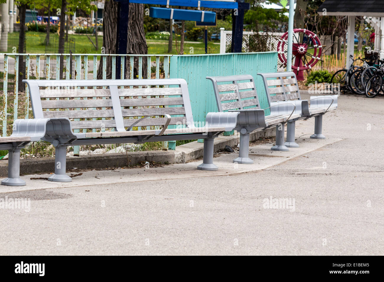 Benches along the docks for passengers to sit on while waiting for the ferry on Ward's Island on the Toronto Islands Stock Photo