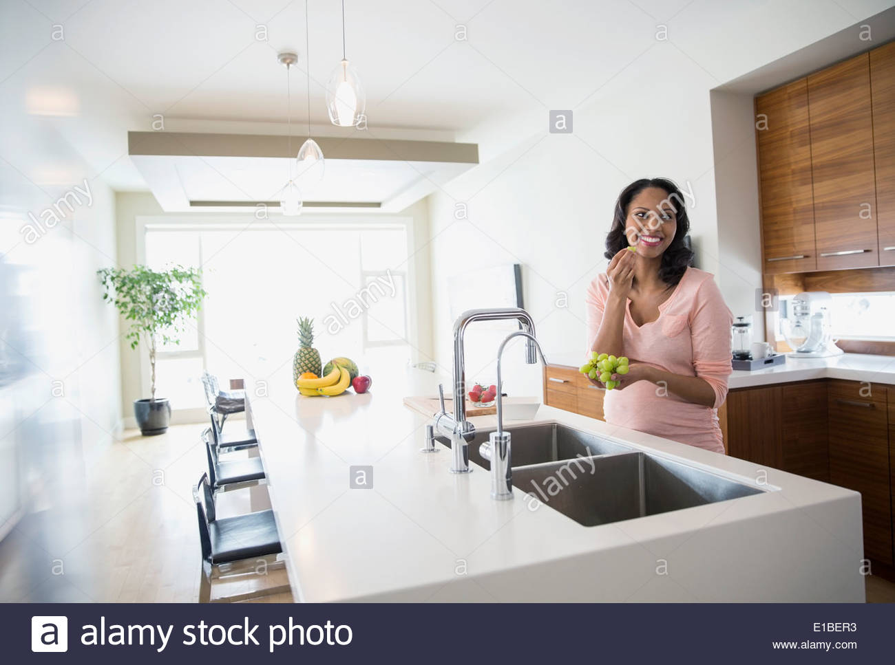 Woman eating grapes hires stock photography and images Alamy