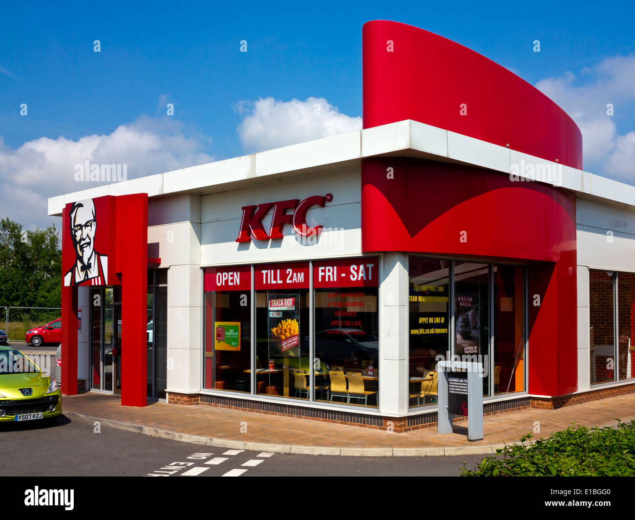 KFC drive in fast food restaurant in Chesterfield Derbyshire England with car parked outside Stock Photo