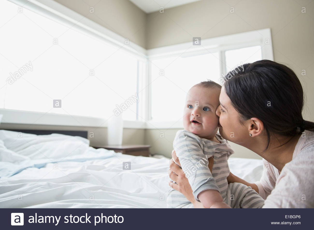 Mother kissing baby hires stock photography and images Alamy