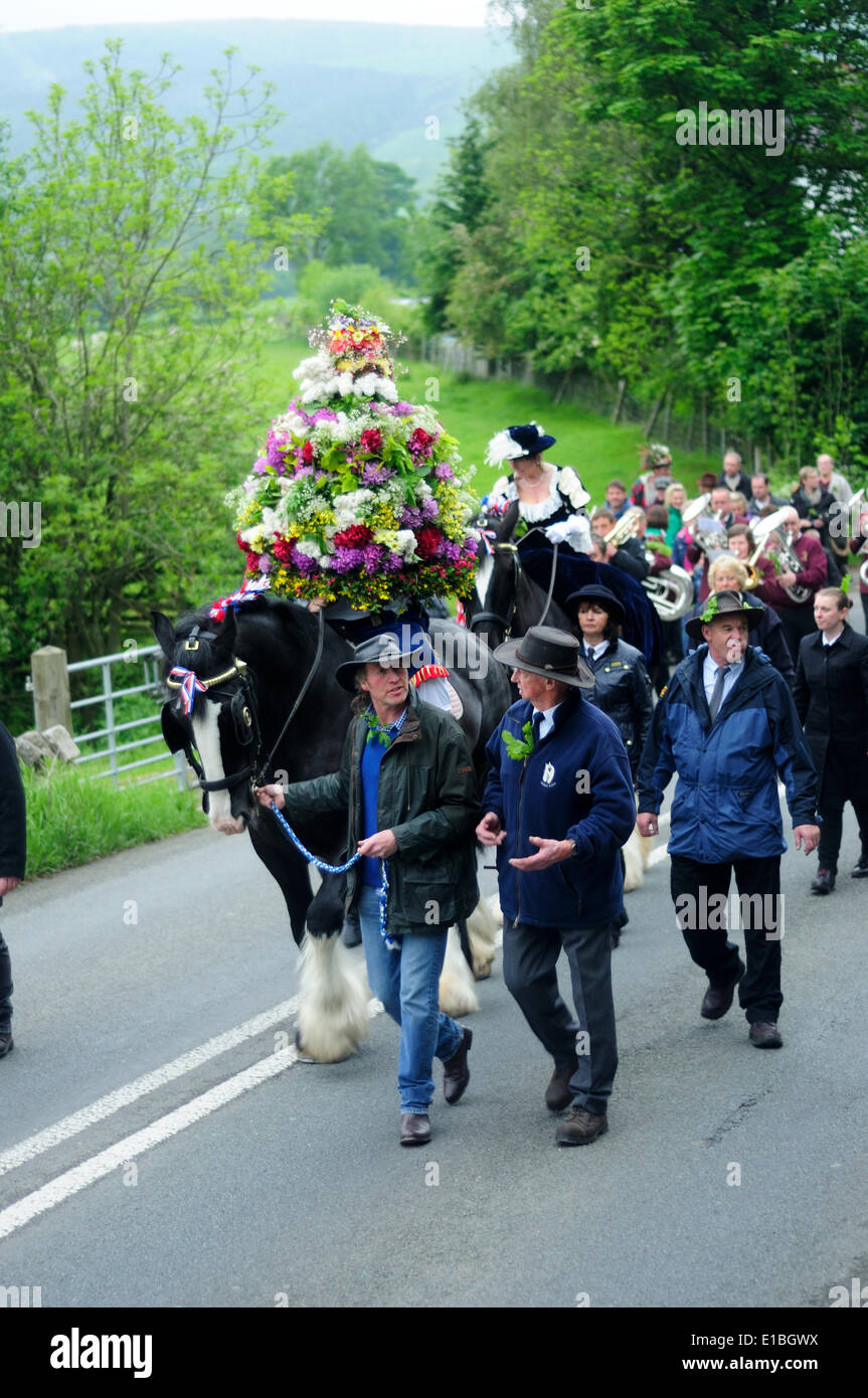 Castleton, Derbyshire, UK.29th May 2014.Castleton Garland Day is traditionally held on Oak Apple Day, 29 May, which commemorates the restoration of the British Monarchy in 1660 after the brief republic installed by Oliver Cromwell. The ‘oak’ connection recalls the oak tree in which King Charles II hid after the Battle of Worcester in 1651. But the Castleton ceremony is much older than that, probably dating back to pagan times and possibly originally a fertility rite. Credit:  Ian Francis/Alamy Live News Stock Photo