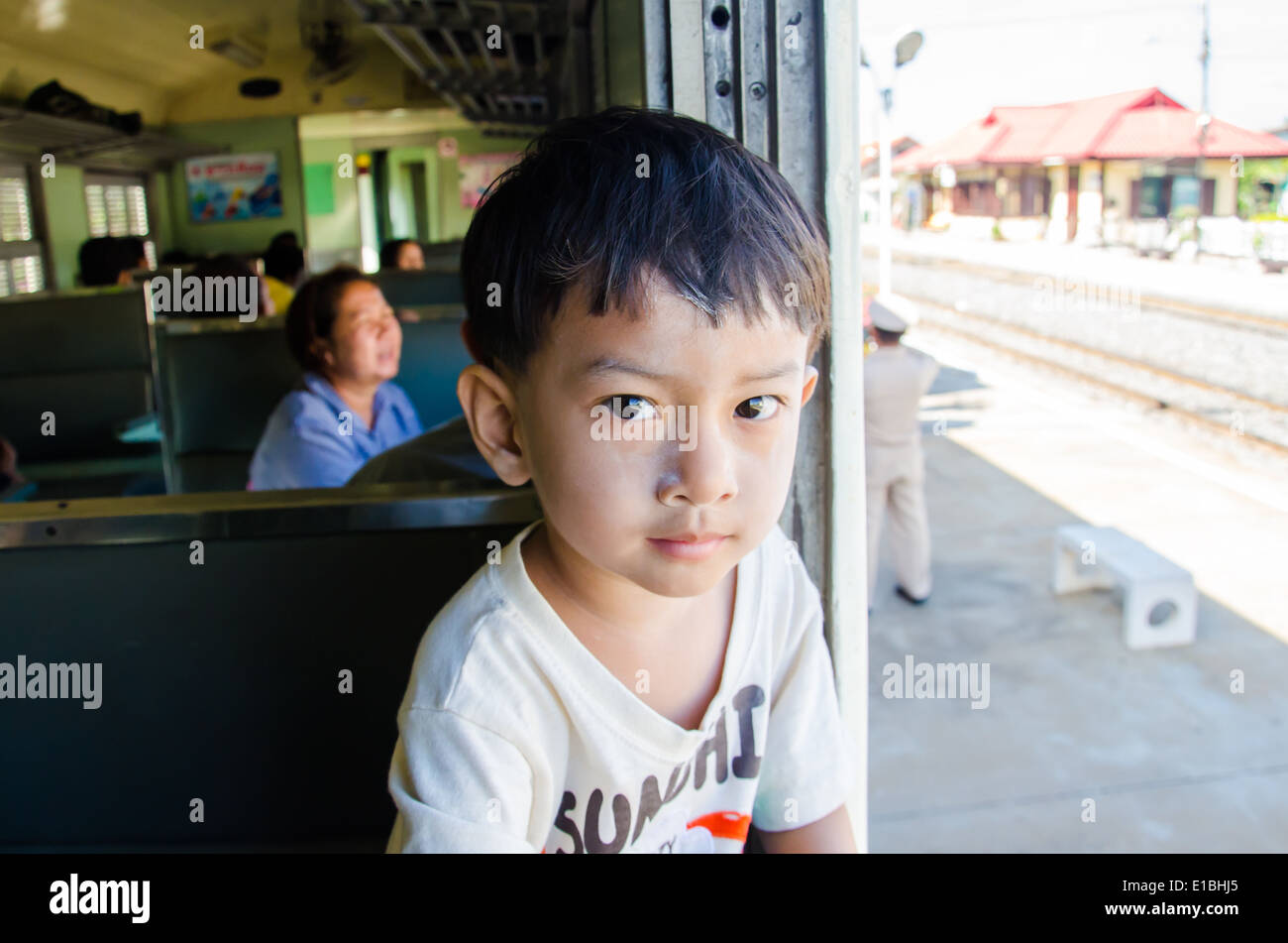 Kid was traveling by train to Bangkok Stock Photo