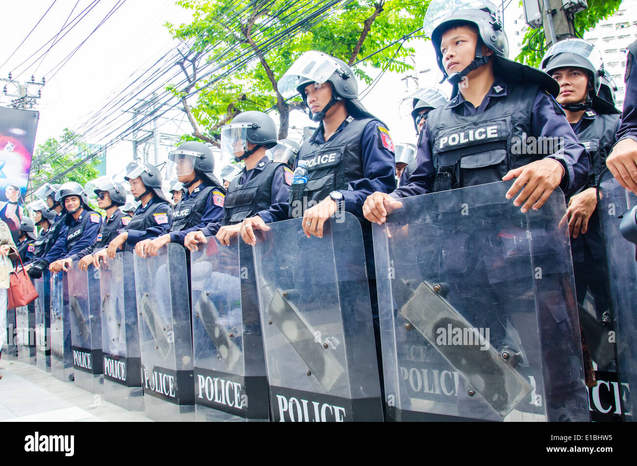 Riot police stand guard during a violent anti-Military coup. Stock Photo