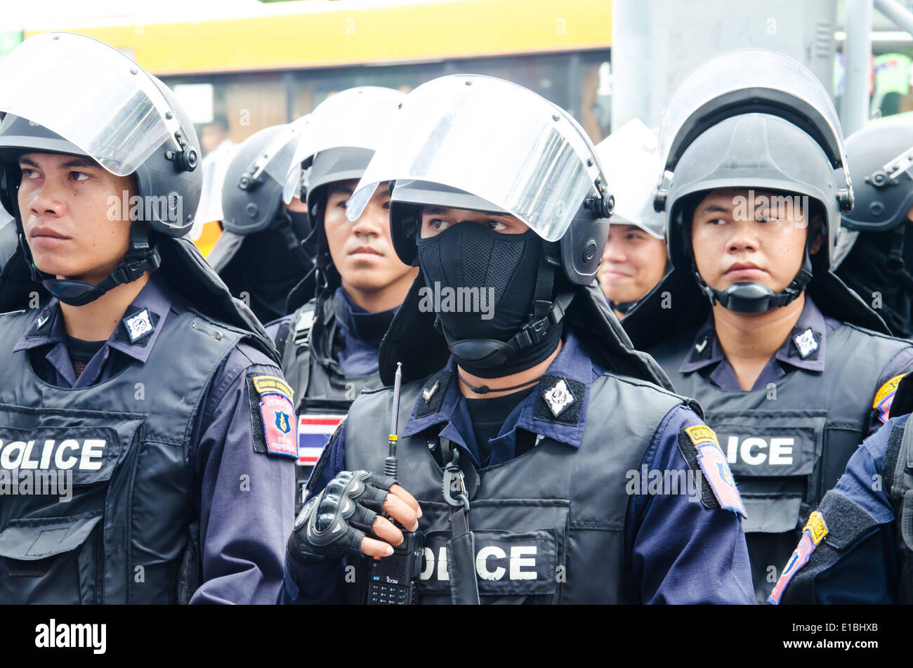 Riot police stand guard during a violent anti-Military coup Stock Photo