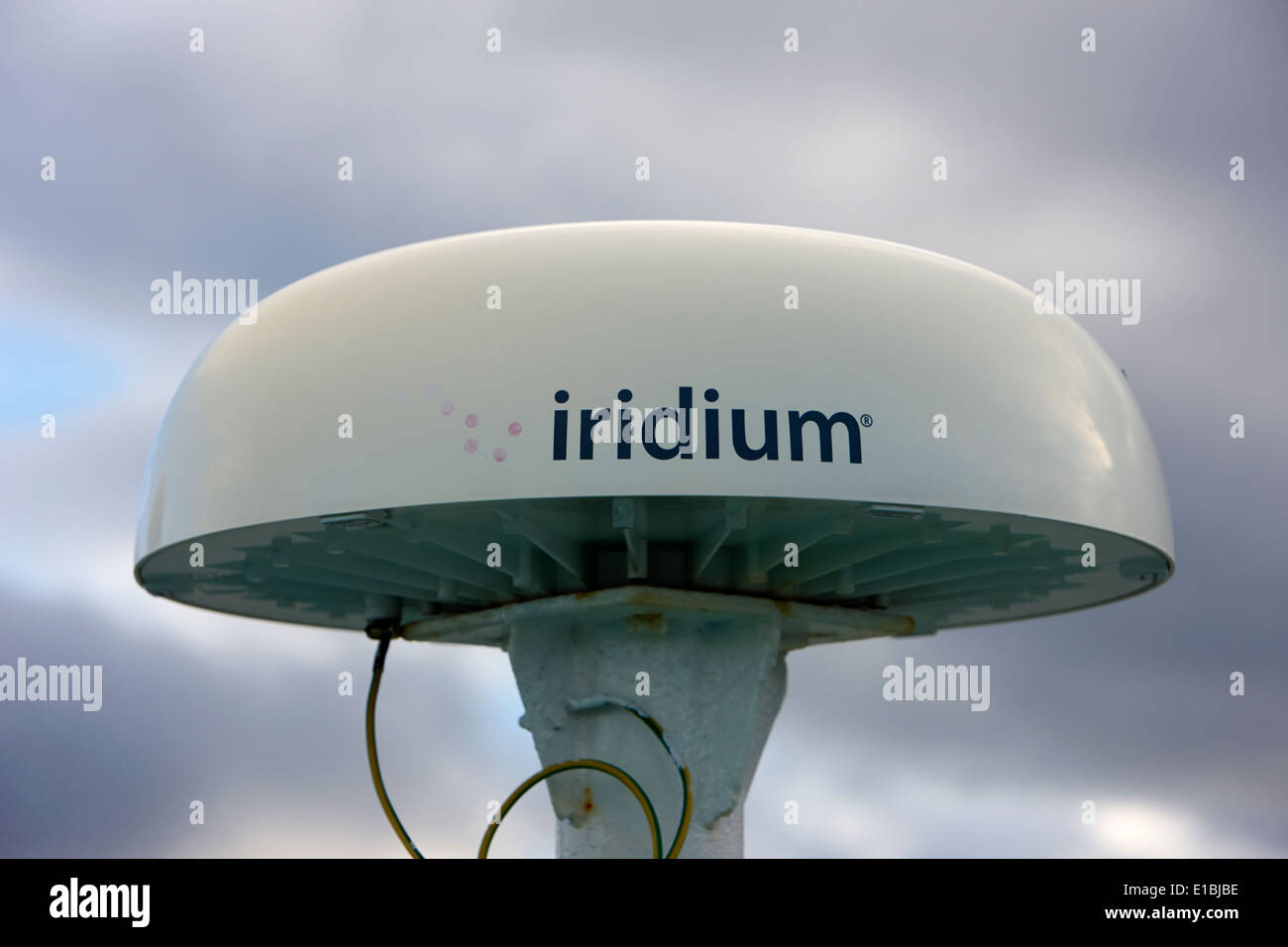 iridium satellite communications land station antenna on board ship Stock Photo