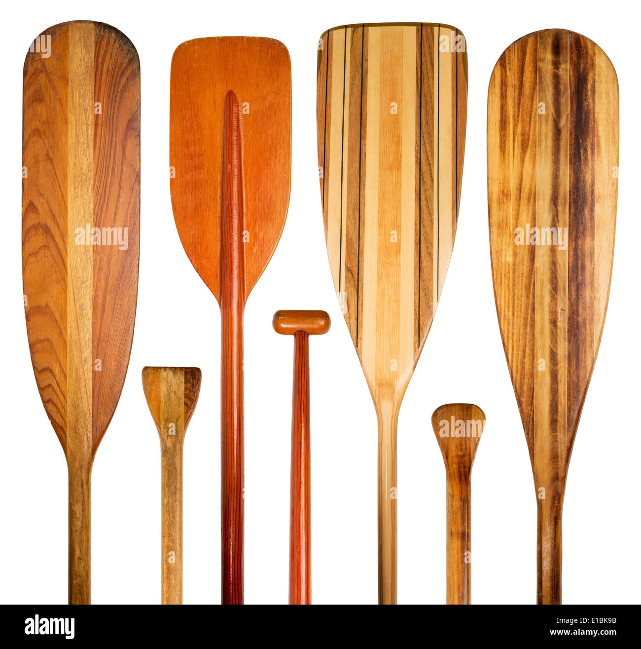 blades and grips of wooden canoe paddles, a variety of styles and