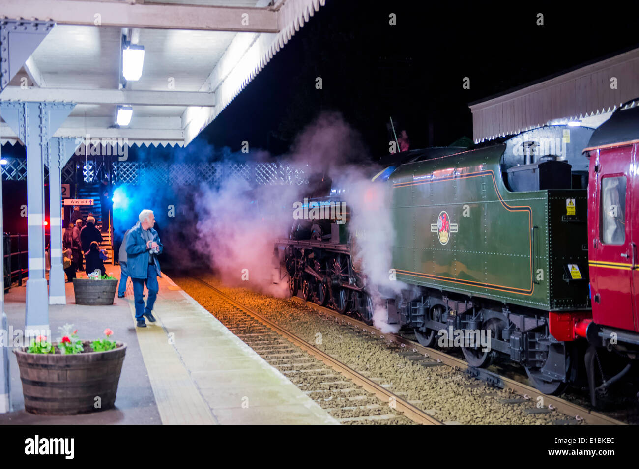 Norfolk, UK. 29th May, 2014. Just before midnight, train spotters and steam enthusiasts gather at Wymondham station Norfolk for the arrival of LMS Jubilee Class 6P 4-6-0 no 45699 Galatea LMS Roal Scot Class 7P 4-6-0 no 46115 Scots Guardsman LMS Class 8F 2-8-0 no 48151 on their journey from Carnforth to Dereham for the weekend steam gala. Credit:  Major Gilbert/Alamy Live News Stock Photo