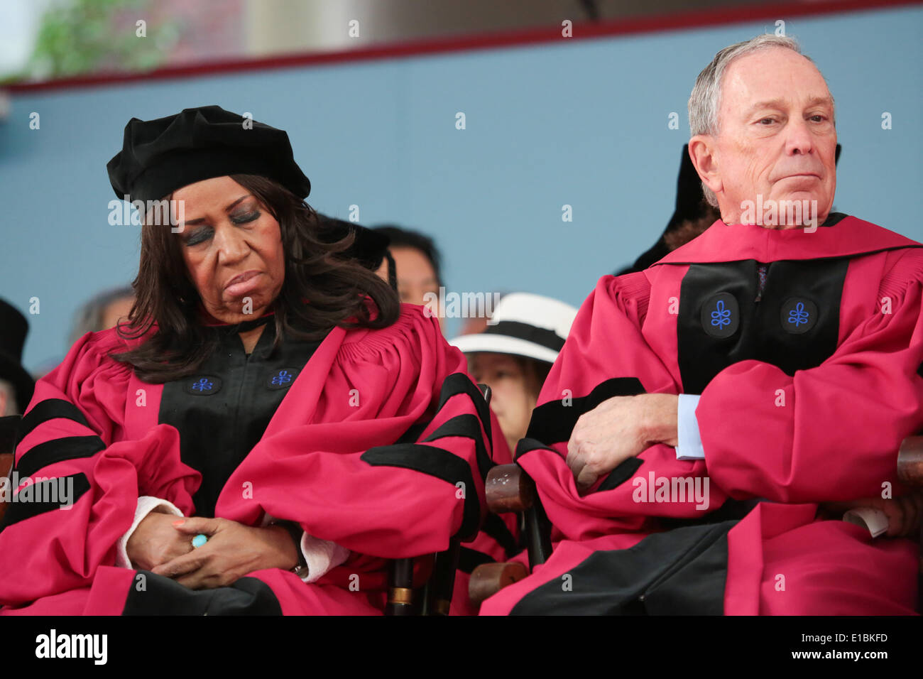 Cambridge, Massachusetts, USA. 29th May, 2014. Legendary singer Aretha Franklin rests her eyes as she sits beside former New York Mayor City Michael Bloomberg during Harvard University's 363rd commencement ceremony in Cambridge, Massachusetts. Franklin and Bloomberg were among several guests who received honorary degrees during the commencement. Credit:  Nicolaus Czarnecki/METRO Boston/ZUMAPRESS.com/Alamy Live News Stock Photo