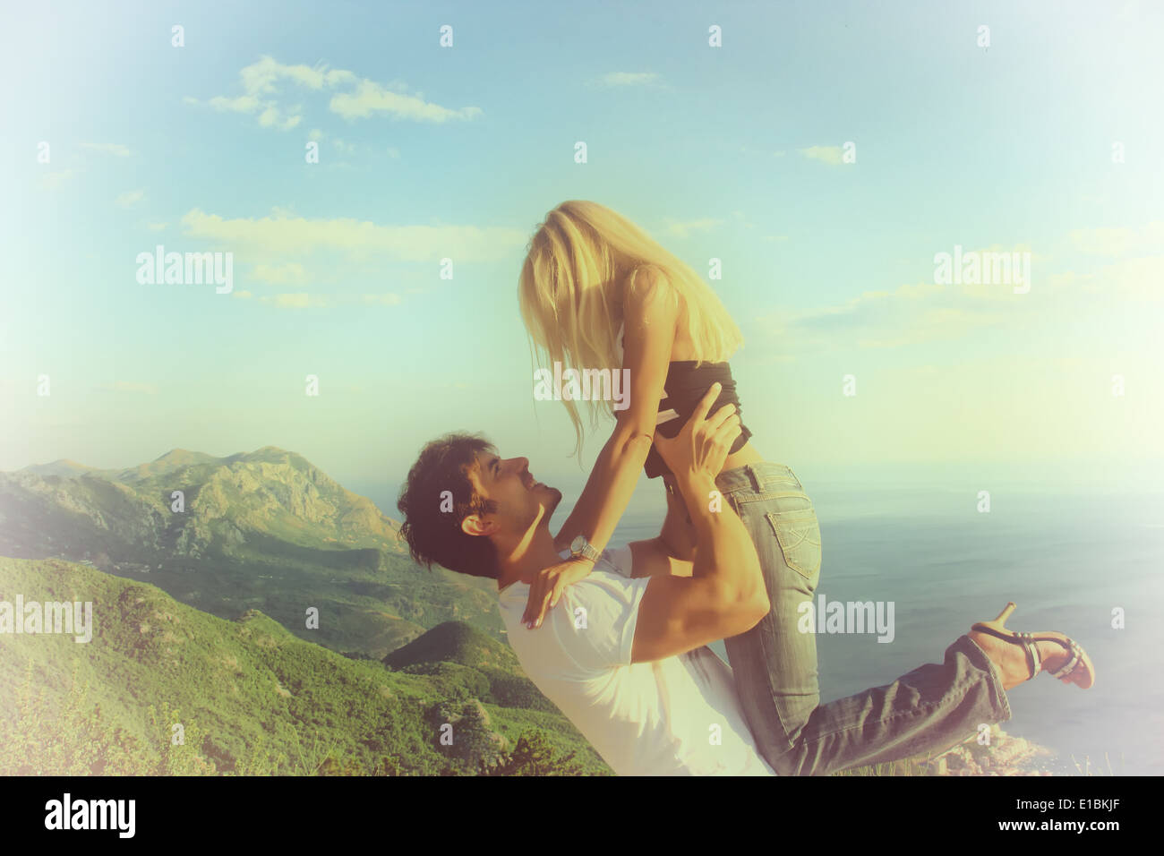 Man lifting up his girlfriend Stock Photo - Alamy