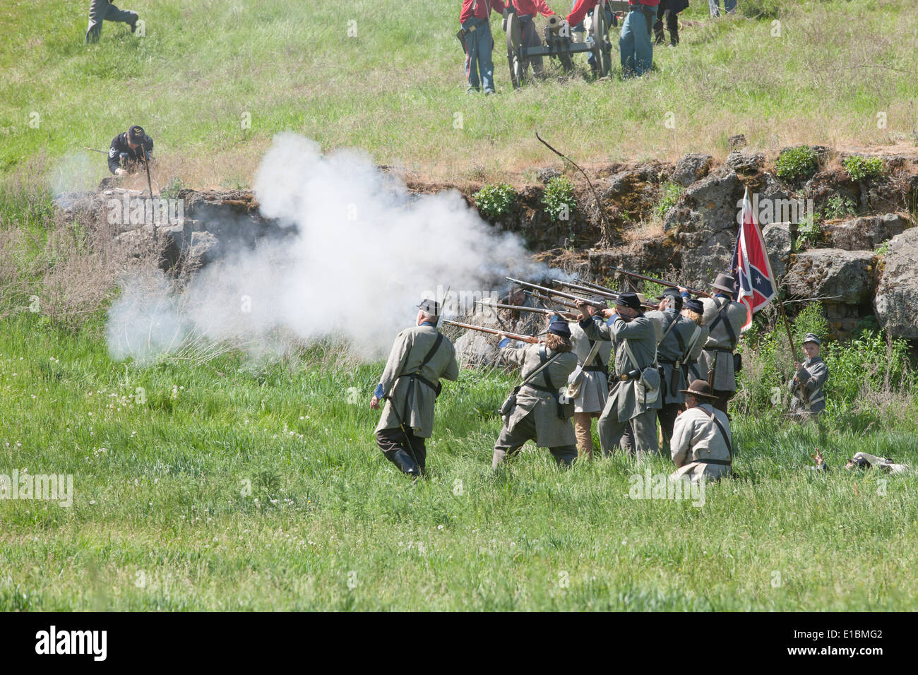 Confederate army reenactors in mock battle. Stock Photo