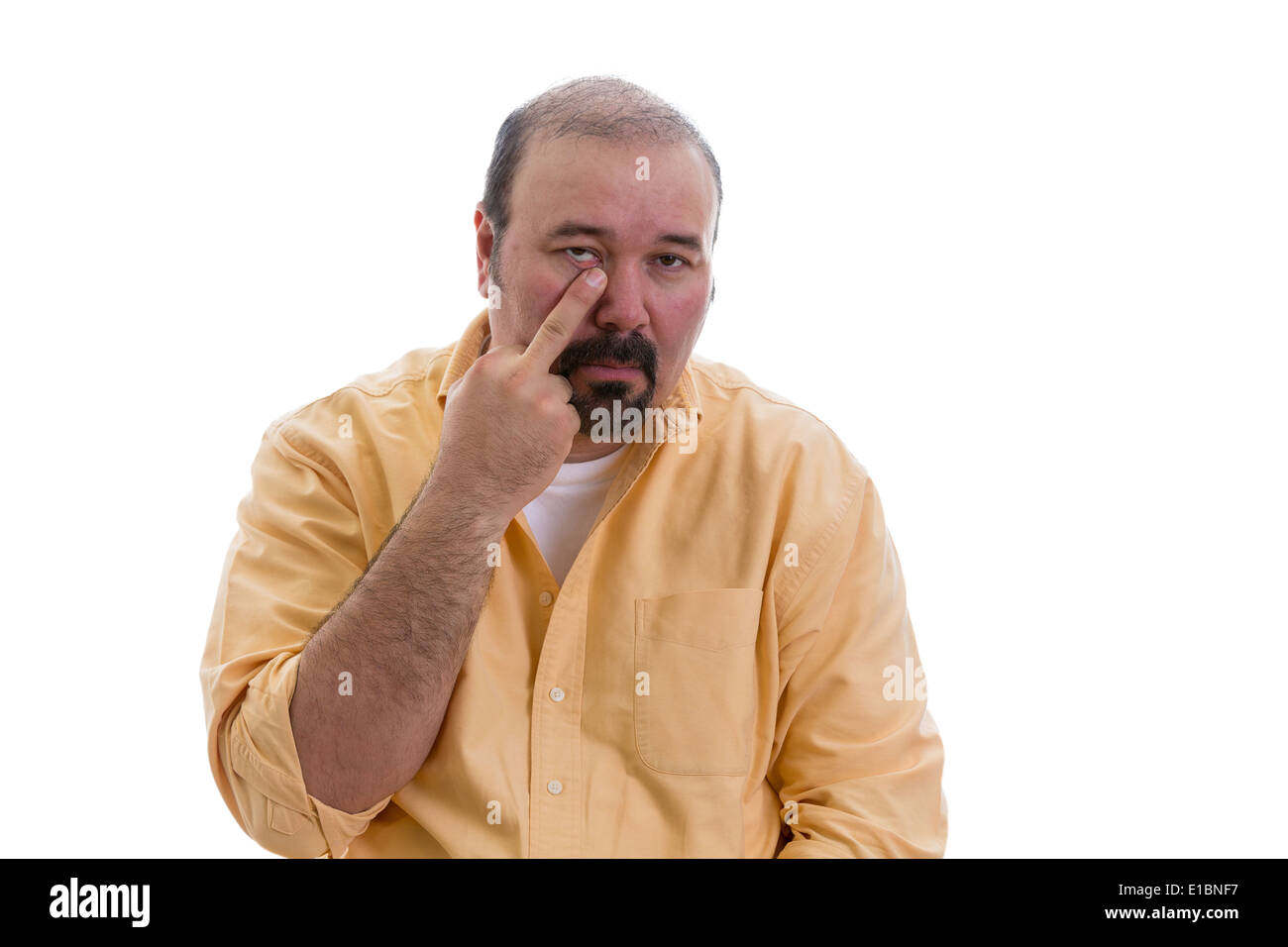 Man gesturing touching his nose with a finger showing that he knows a secret and the viewer would be wise to pay special heed Stock Photo