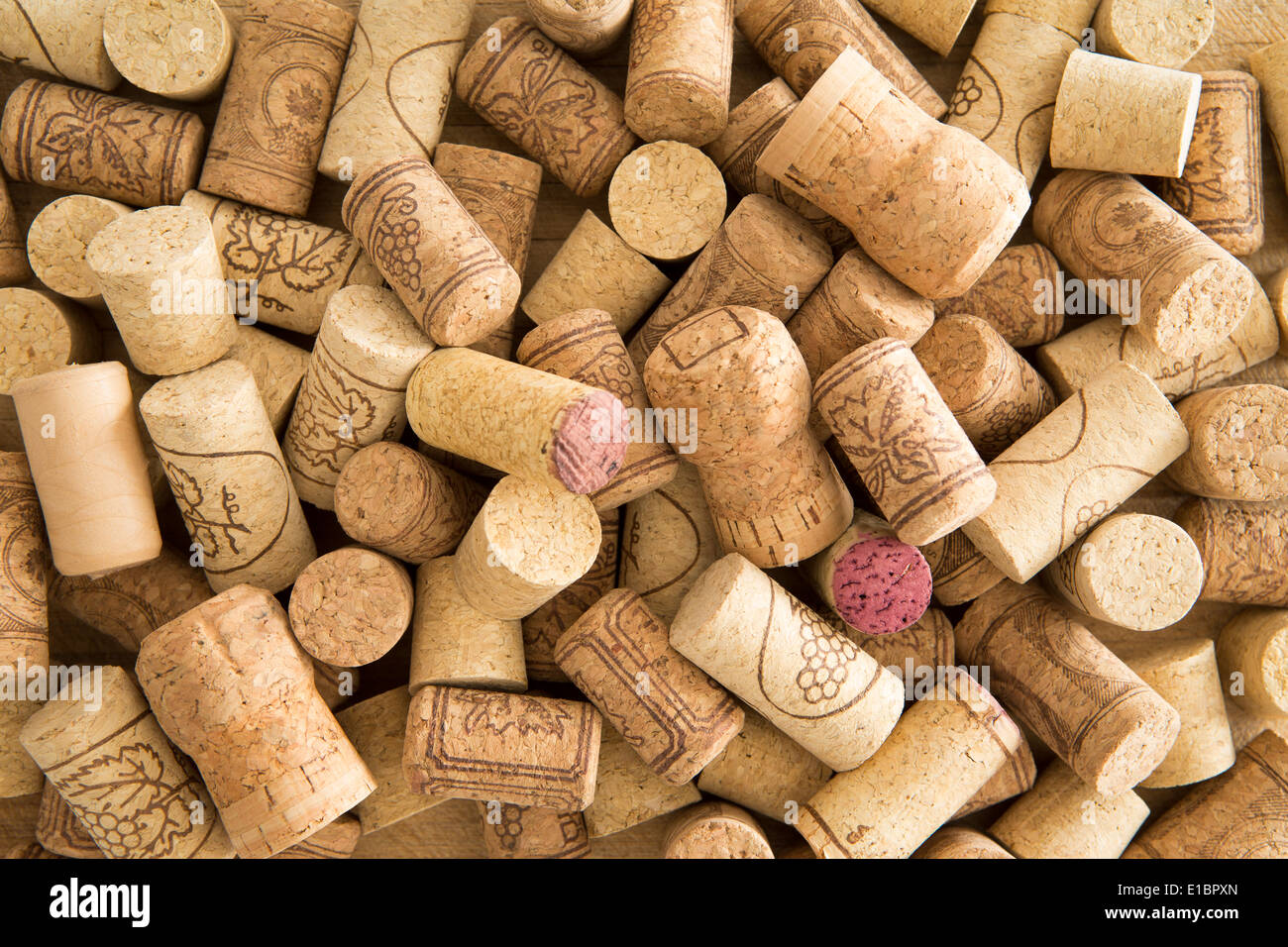 Background texture of a randomly scattered pile of assorted used wine corks with cultivar and winery details on the surface of t Stock Photo
