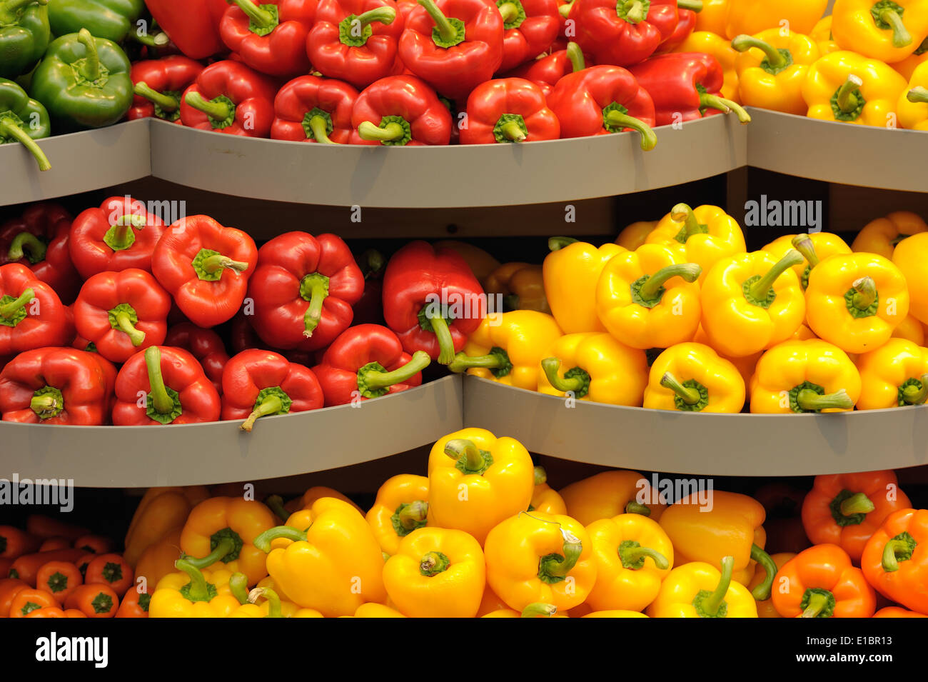 Several pods of varicolored sweet pepper, capsicum Stock Photo