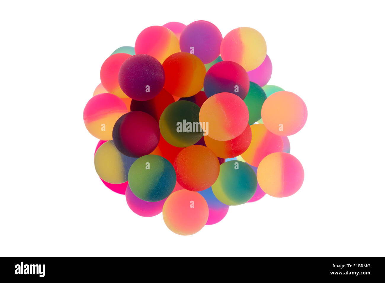 Cup filled with multiple bicolor plastic balls in vibrant rainbow colors viewed from above centered and isolated on a white back Stock Photo