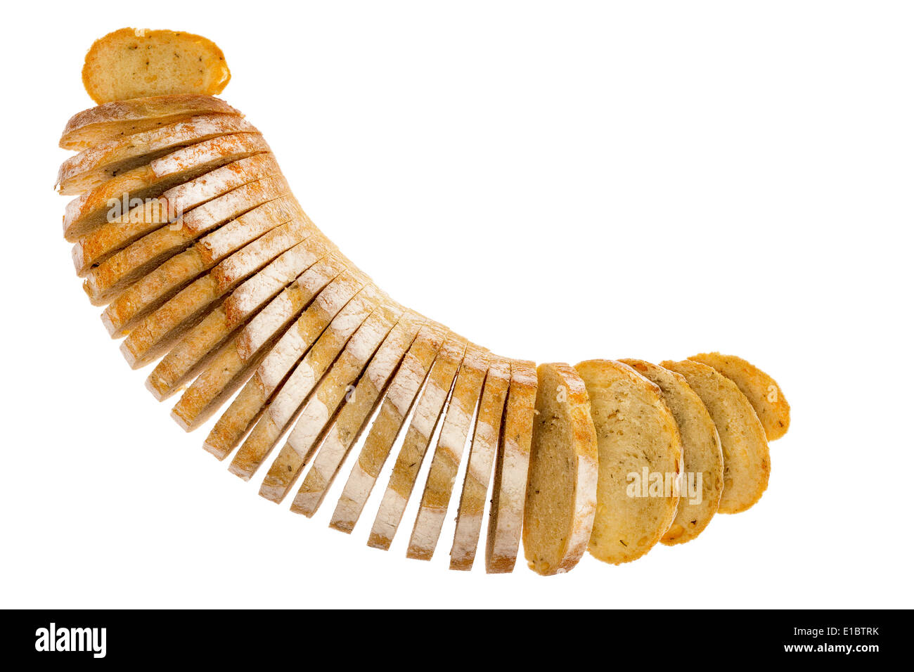 Fresh loaf of sliced rosemary and potato bread arranged in a crescent shape with the slices splayed, viewed from above isolated Stock Photo