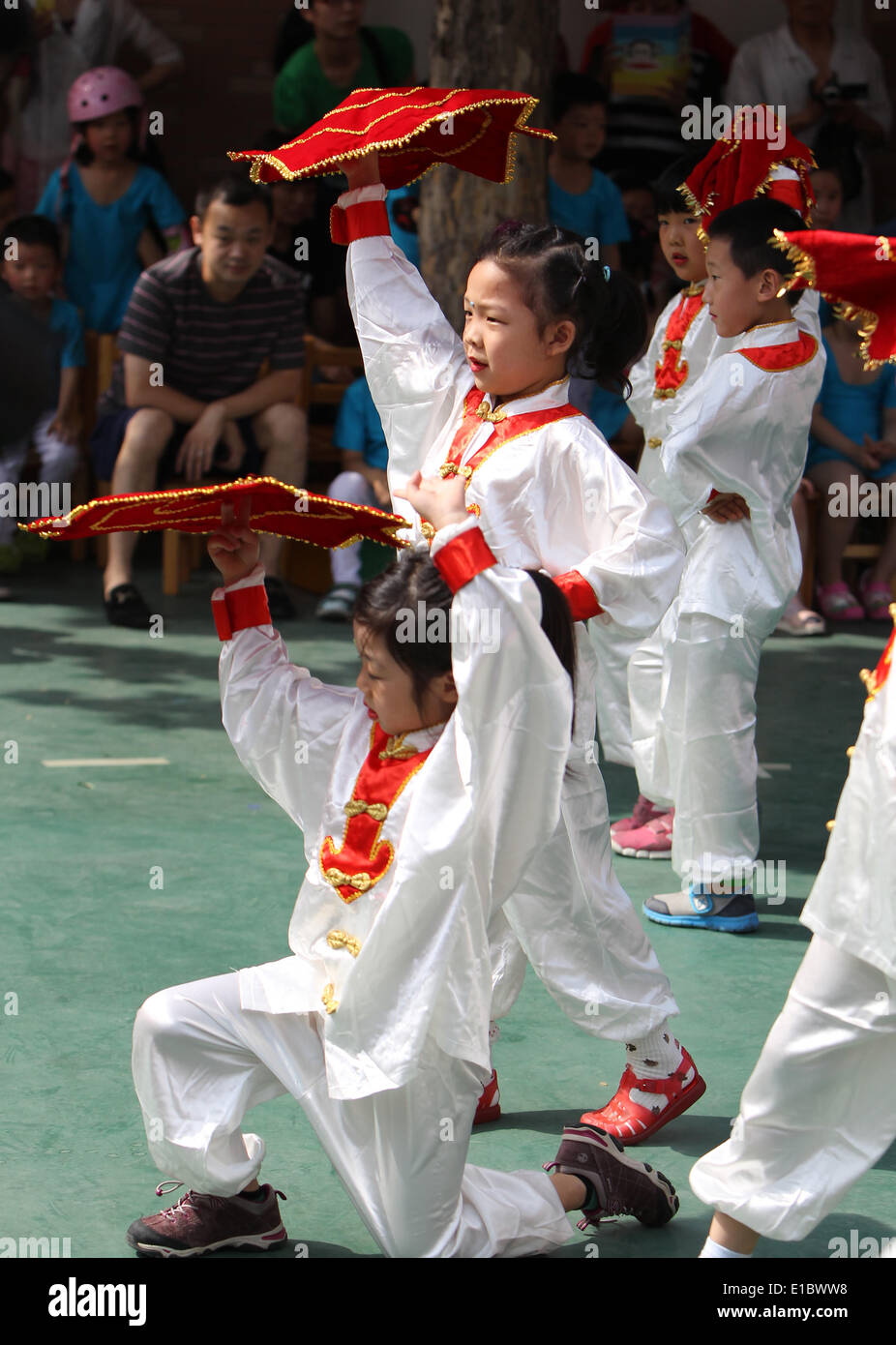 Beijing, China. 30th May, 2014. Children perform to greet the upcoming ...