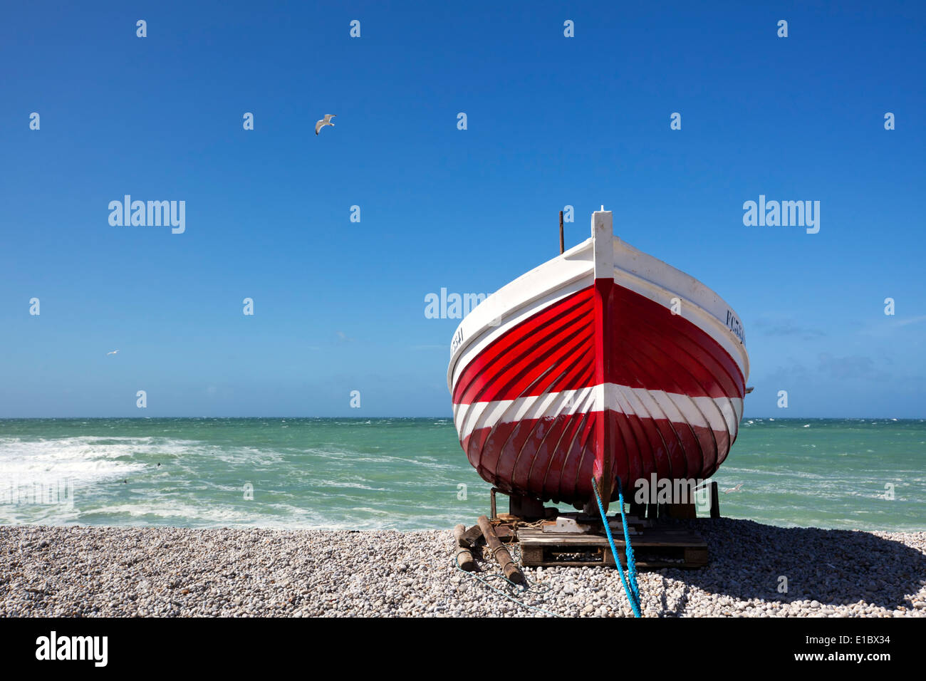 Red fishing boat at the beach of Etretat, Normandy, France Stock Photo ...