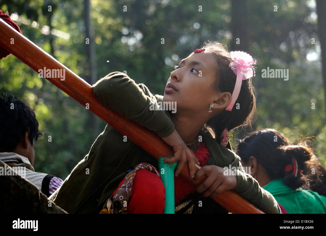 Nepal,Asia,Young lady is leaning on railing,candid  street, scenes photos,coldly, cute,this is life, photography Stock Photo