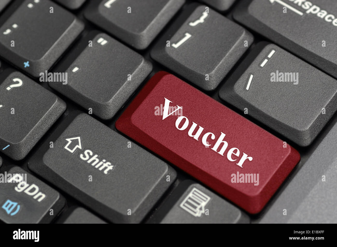 Red voucher key on keyboard Stock Photo