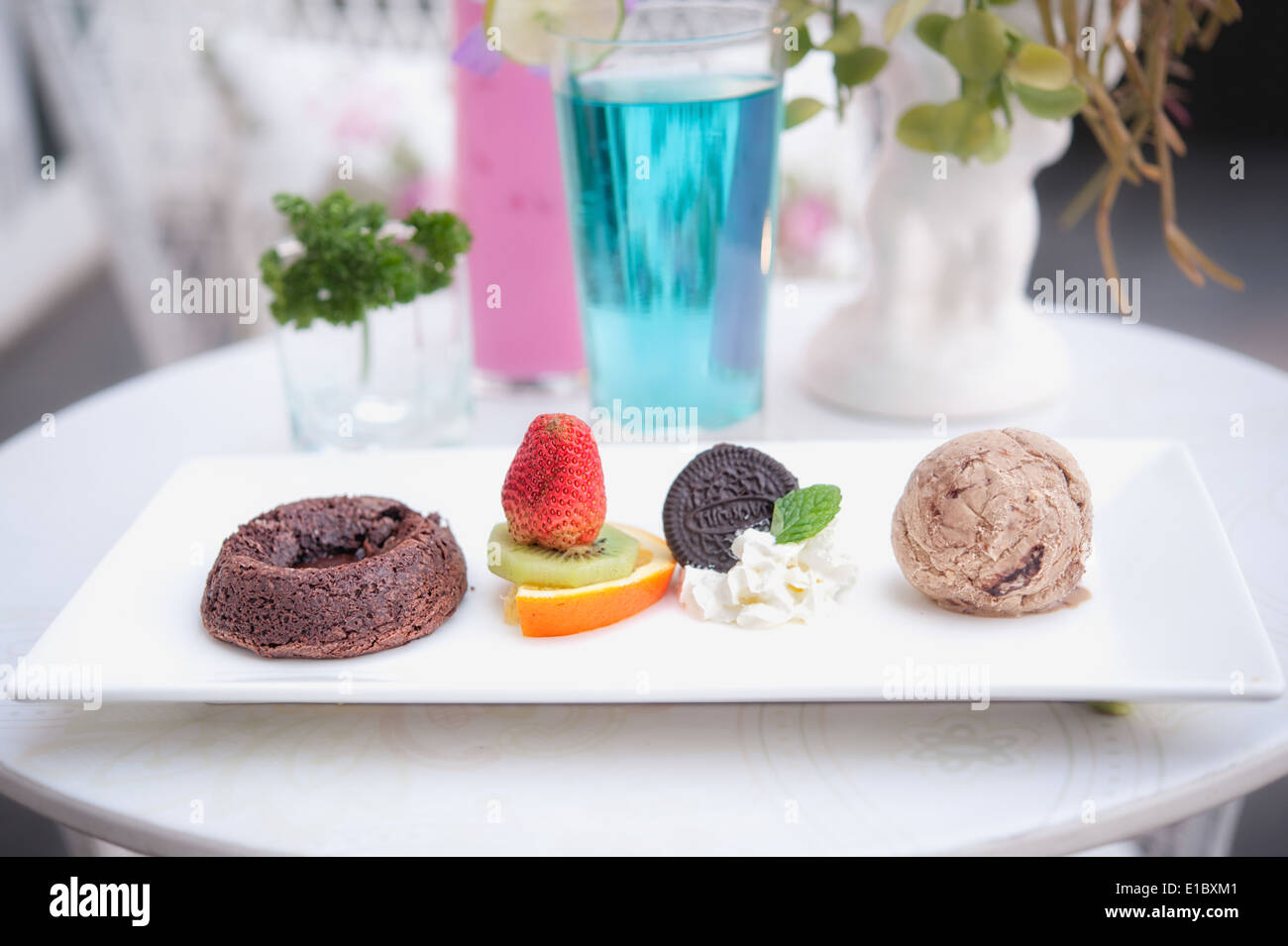 Chocolate fondant cake with fruit and ice-cream Stock Photo