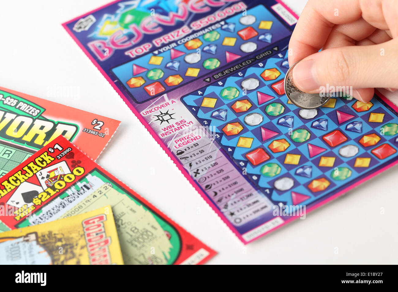 Scratching lottery tickets Stock Photo - Alamy