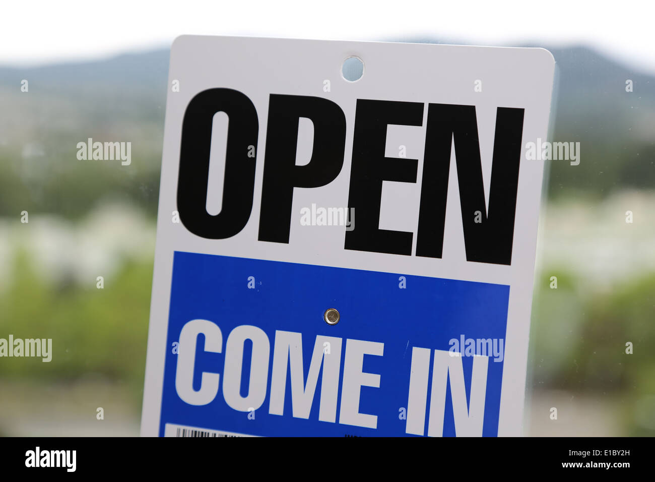 Come in and open sign with nature background Stock Photo