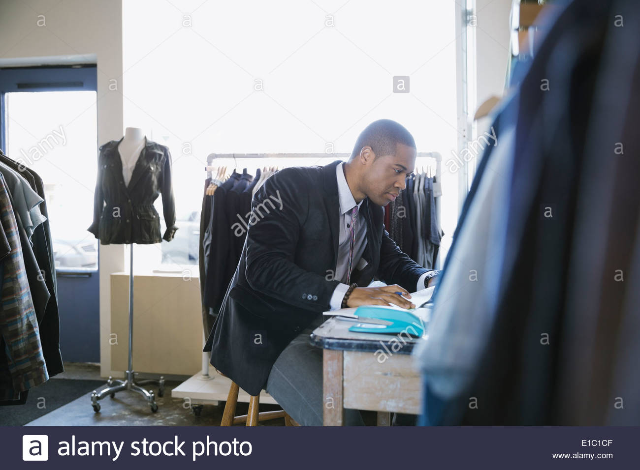 Business owner working in clothing shop Stock Photo