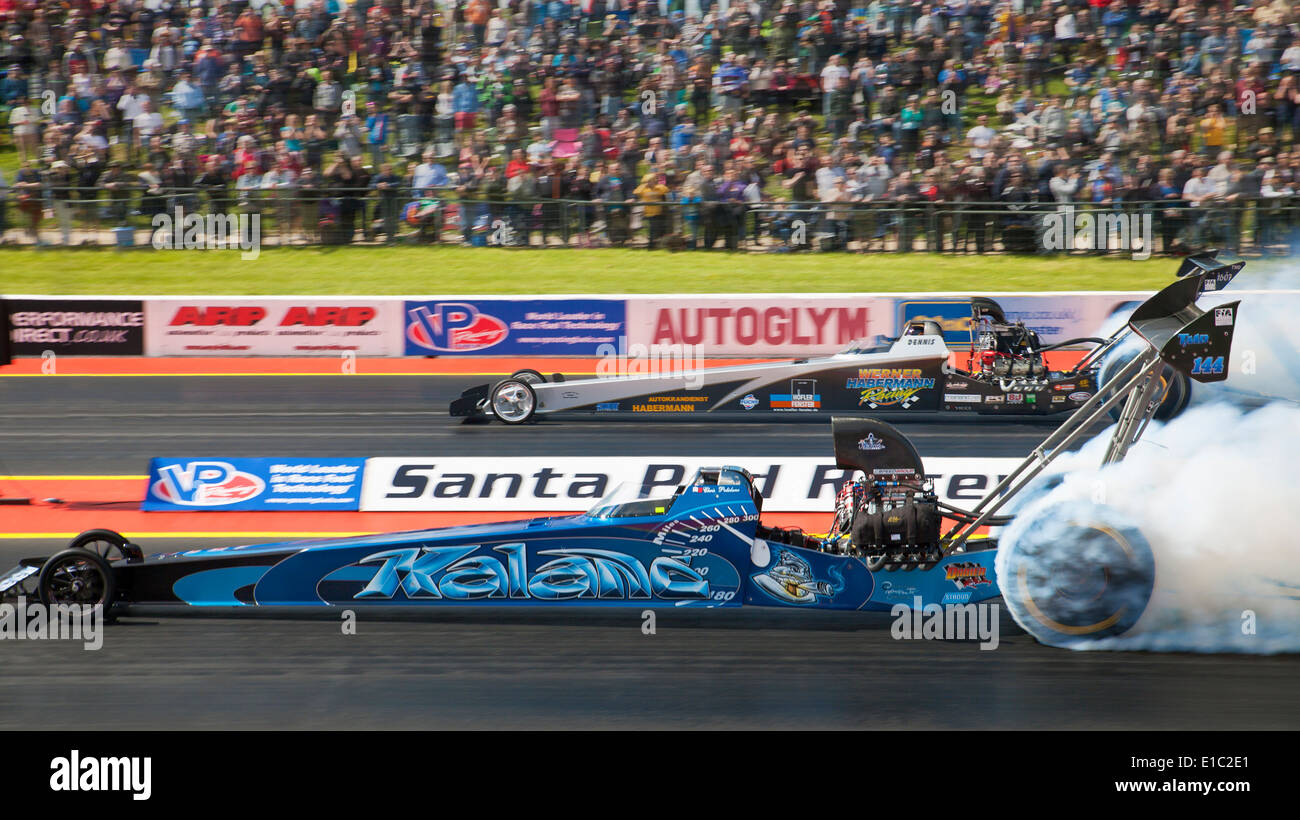 Top Methanol Drag racing at Santa Pod. Christopher Polidano nearside, Dennis Habermann far side. Stock Photo