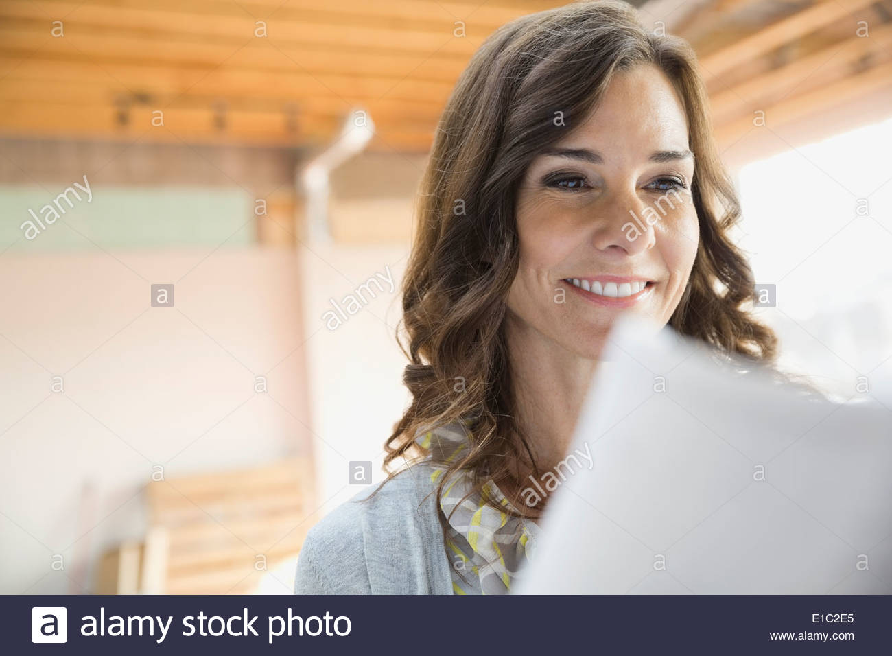 Businesswoman reading paperwork Stock Photo