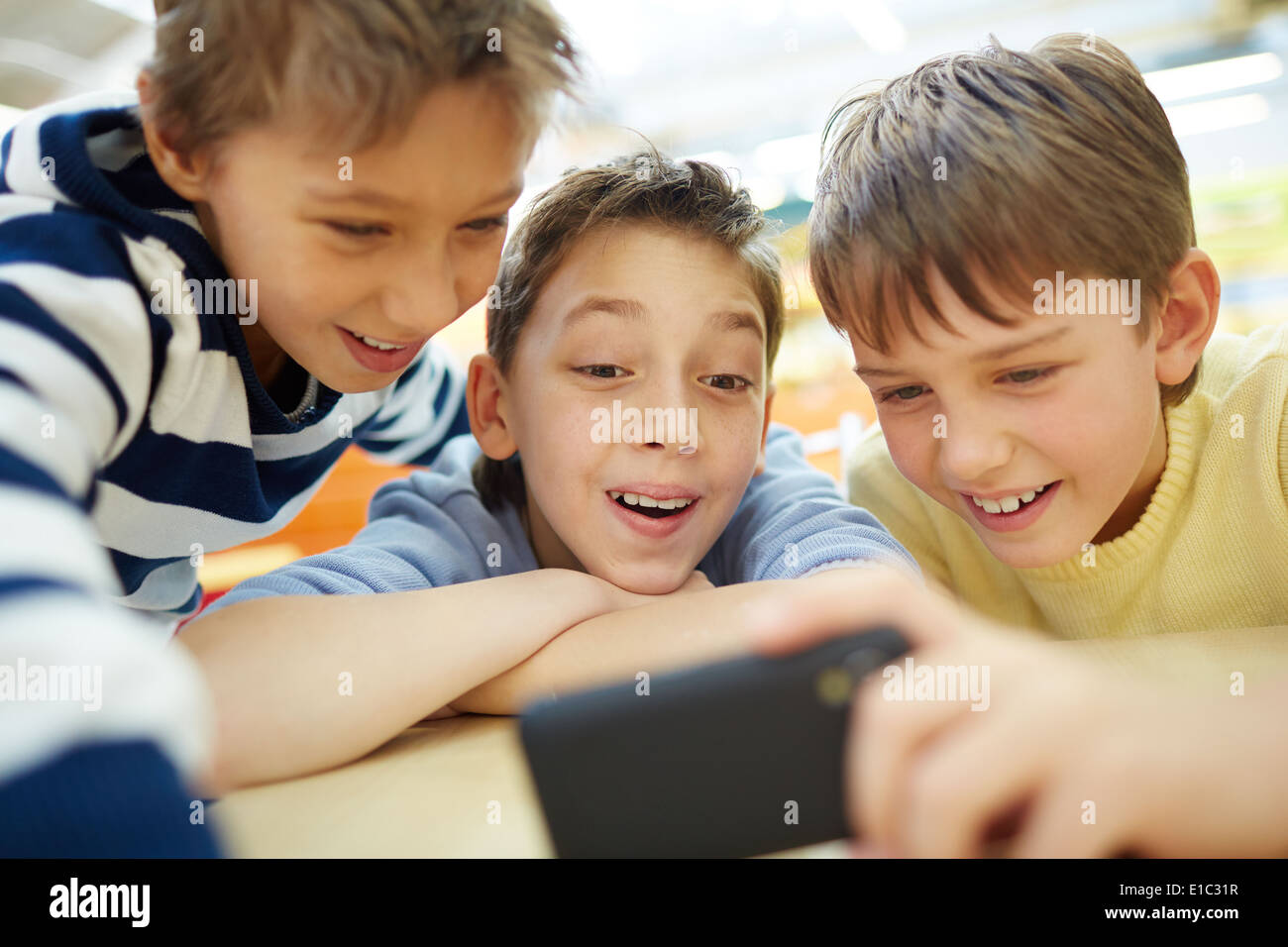 Boys using a new smartphone Stock Photo