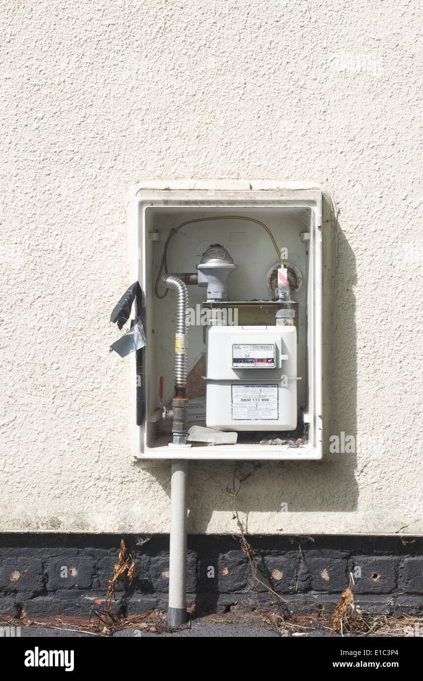 Doorless meter cupboard on exterior wall of house Stock Photo