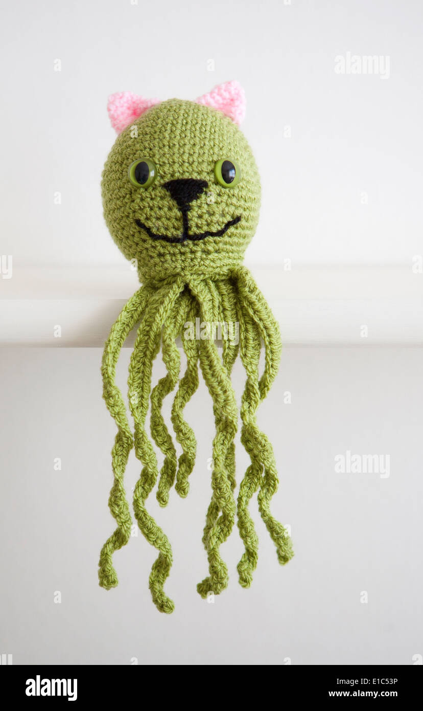 Crocheted Octopus with cat features, Octopussy Stock Photo