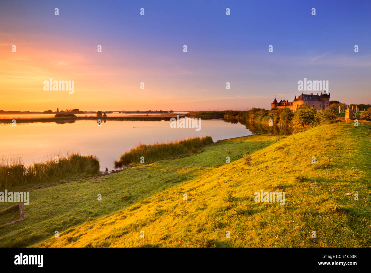 A medieval castle at sunrise Stock Photo - Alamy