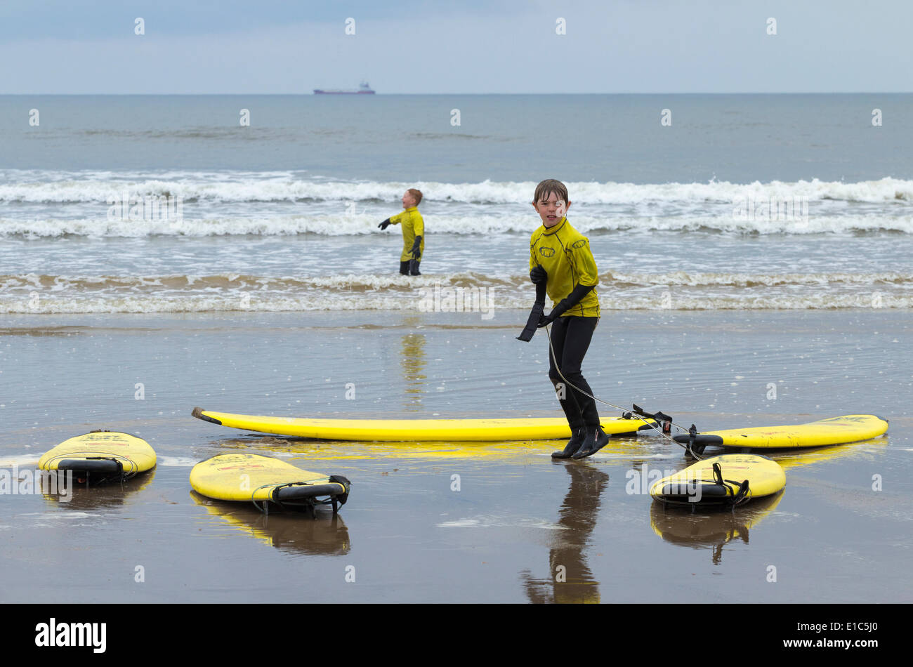 Surfing lesson children kids saltburn hires stock photography and