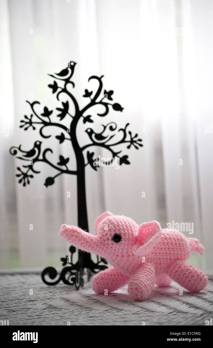 Pink crocheted Amigurumi elephant Stock Photo