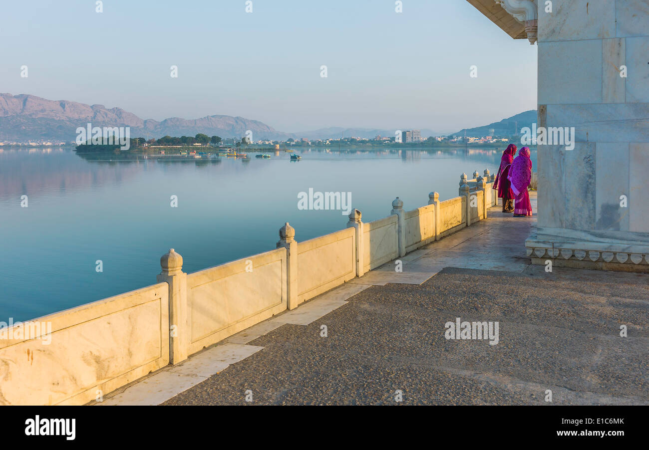 Two women promenade along Anasagar lake at dawn on October 23, 2011 in Ajmer, Rajasthan, India. Stock Photo