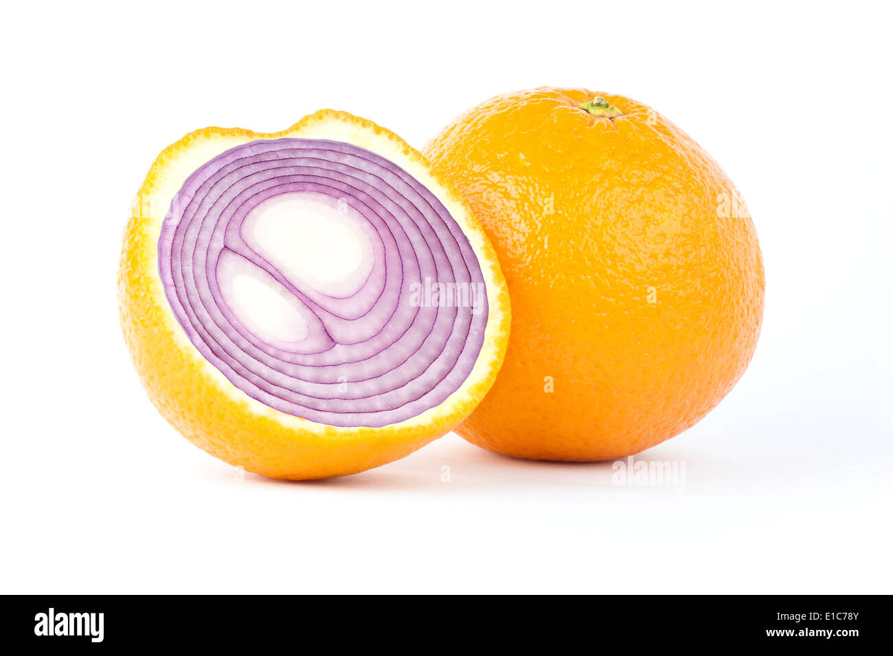 Manipulated image of sliced orange with red onion inside Stock Photo