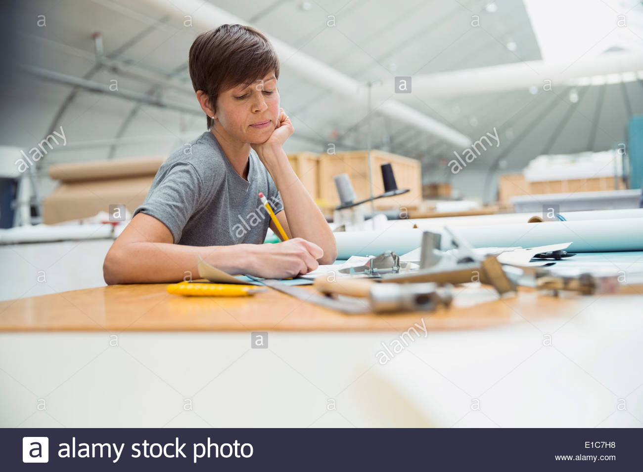 Worker in textile manufacturing plant Stock Photo