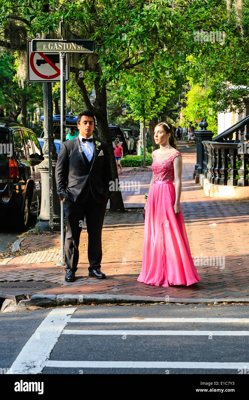 High school prom night with teen boys and girls walking through the streets of Savannah GA Stock Photo