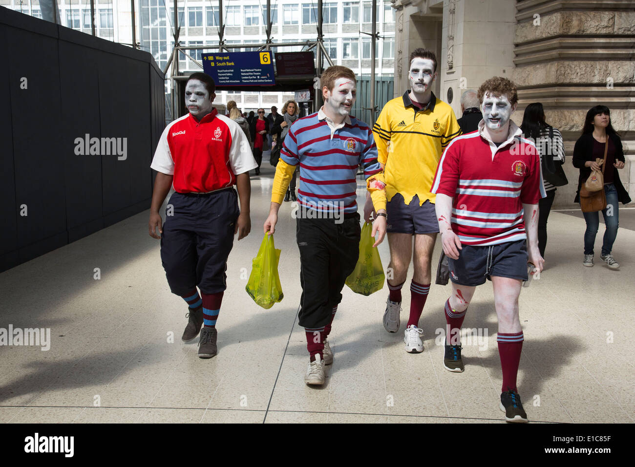 People dressed up in crazy zombie costumes at Waterloo station on their way to the Rugby Sevens tournament. London, UK. Stock Photo