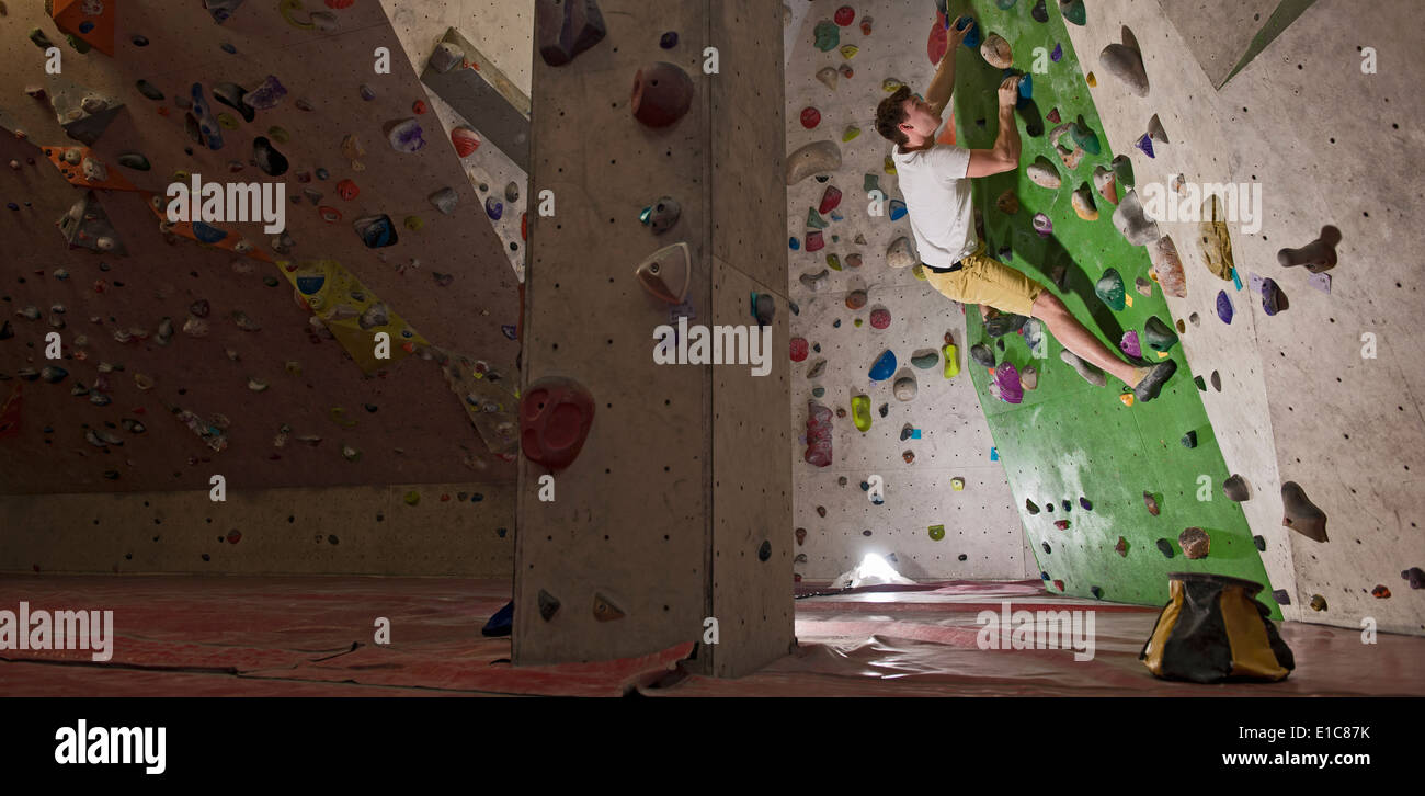 Man climbing indoor wall hi-res stock photography and images - Alamy