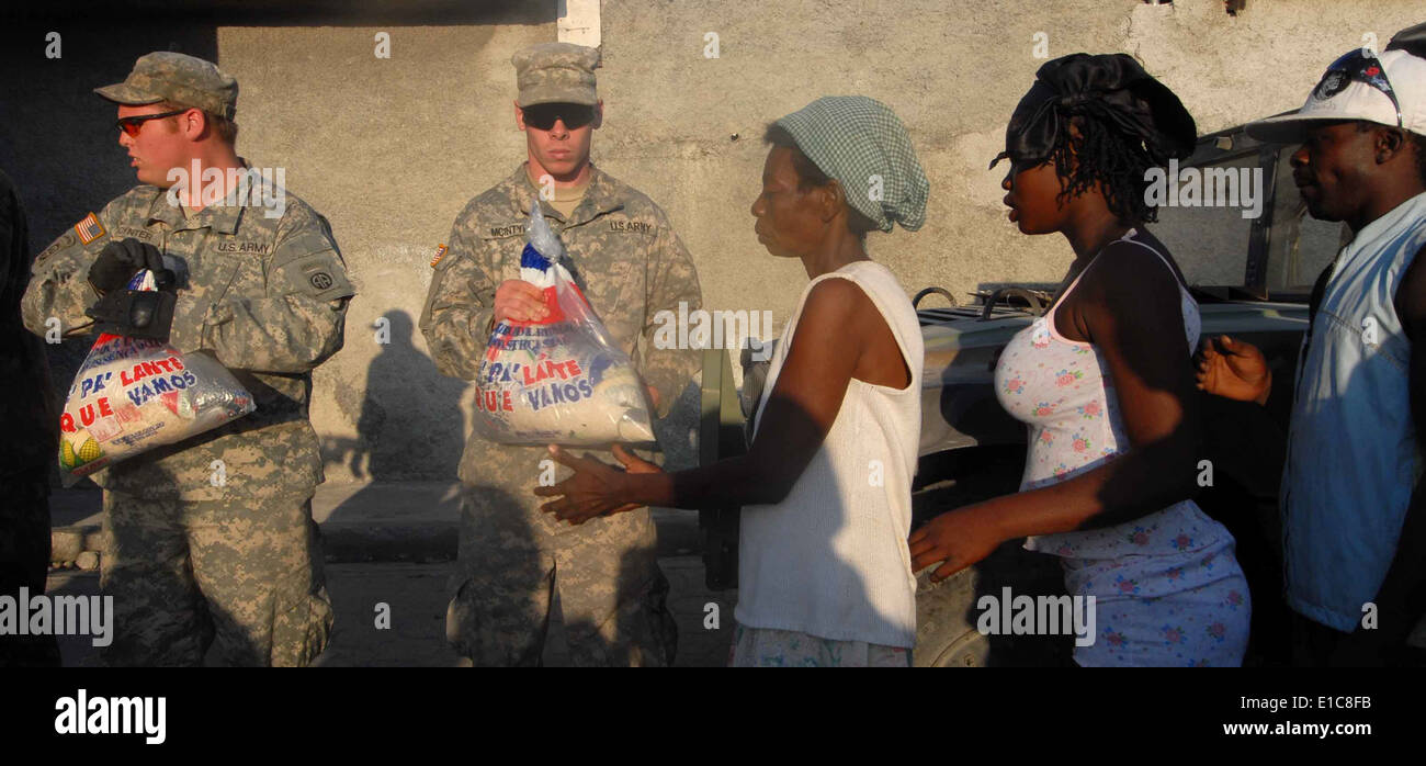 U.S. Soldiers assigned to the 82nd Airborne Division provide relief supplies to earthquake victims Jan. 22, 2010, in Cite De So Stock Photo