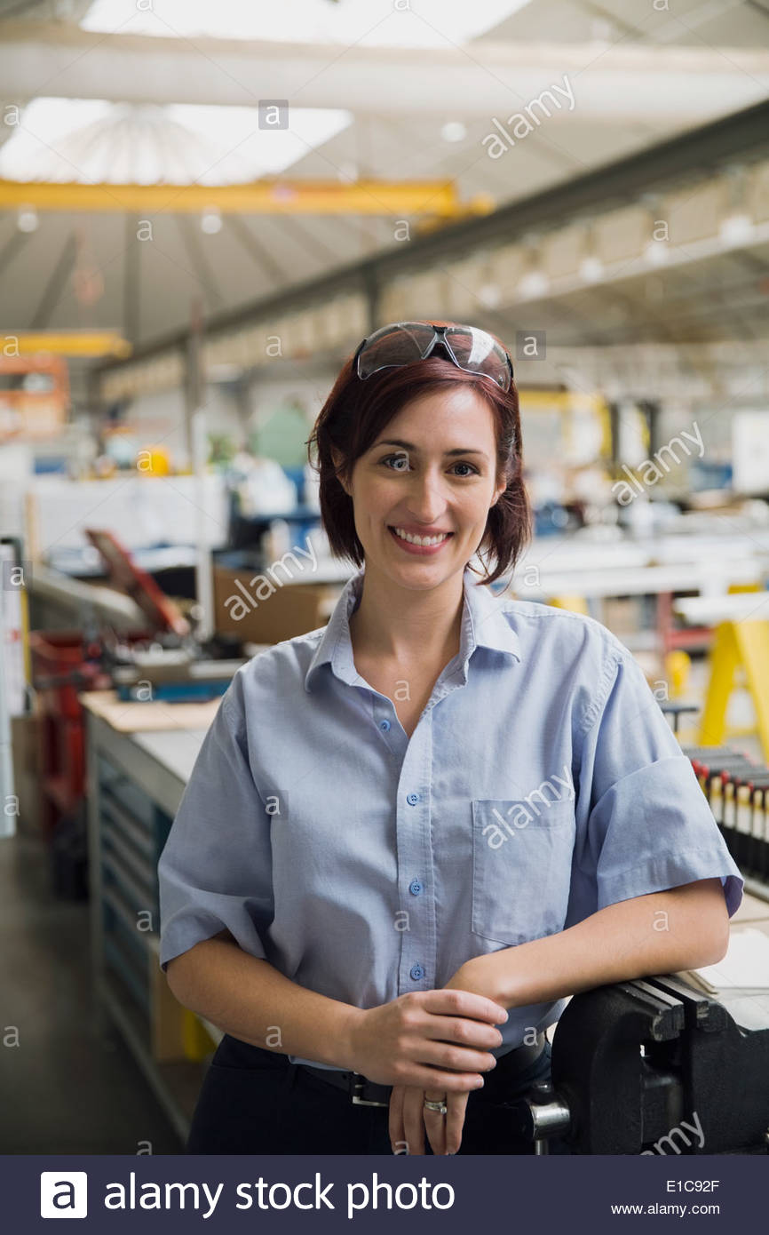 Portrait of confident worker in manufacturing plant Stock Photo