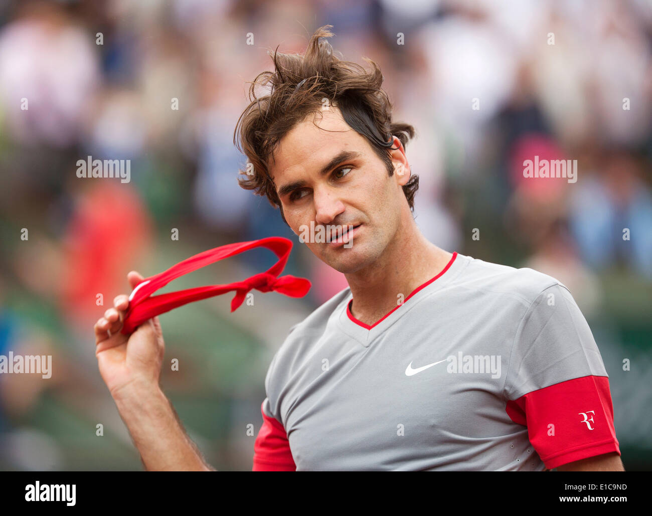 Paris, France. 30th May 2014. Tennis, French Open, Roland Garros, Roger Federer (SUI) takes off his had band Photo:Tennisimages/Henk Koster/Alamy Live News Stock Photo
