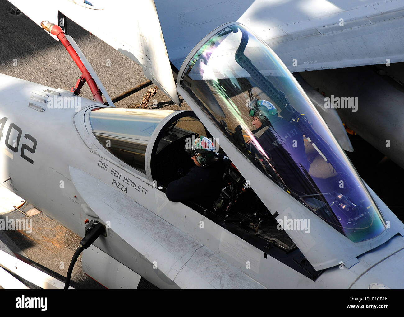 U.S. Navy aviation electronics technicians work on an F/A18