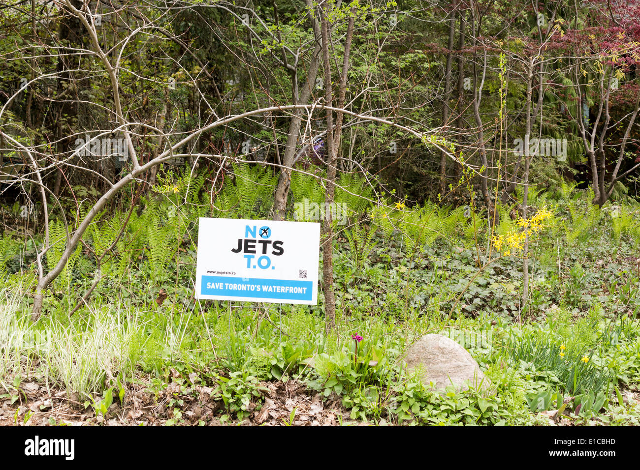 No jets t.o. sign in grass along path on Ward's Island on Toronto Islands protesting the expansion of Billy Bishop Airport. Stock Photo