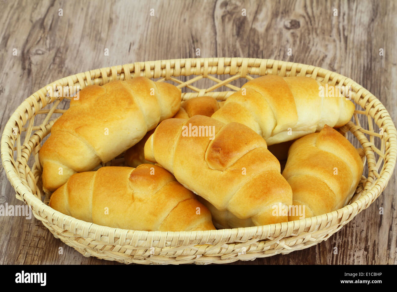 Butter croissants in bread basket Stock Photo
