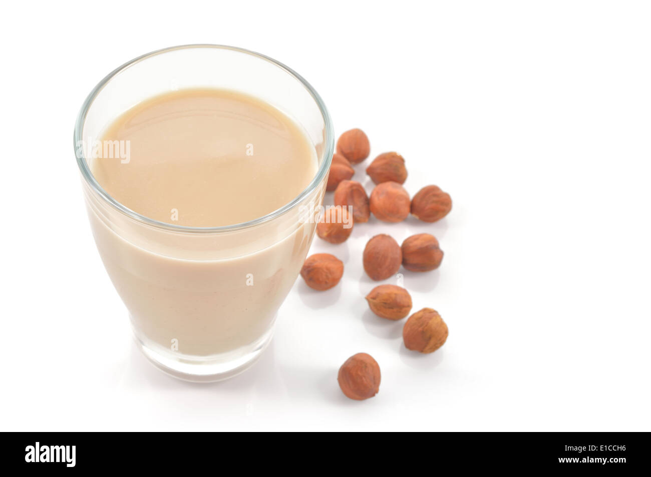 Glass of hazelnut milk or drink as a substitute for dairy milk. Glass