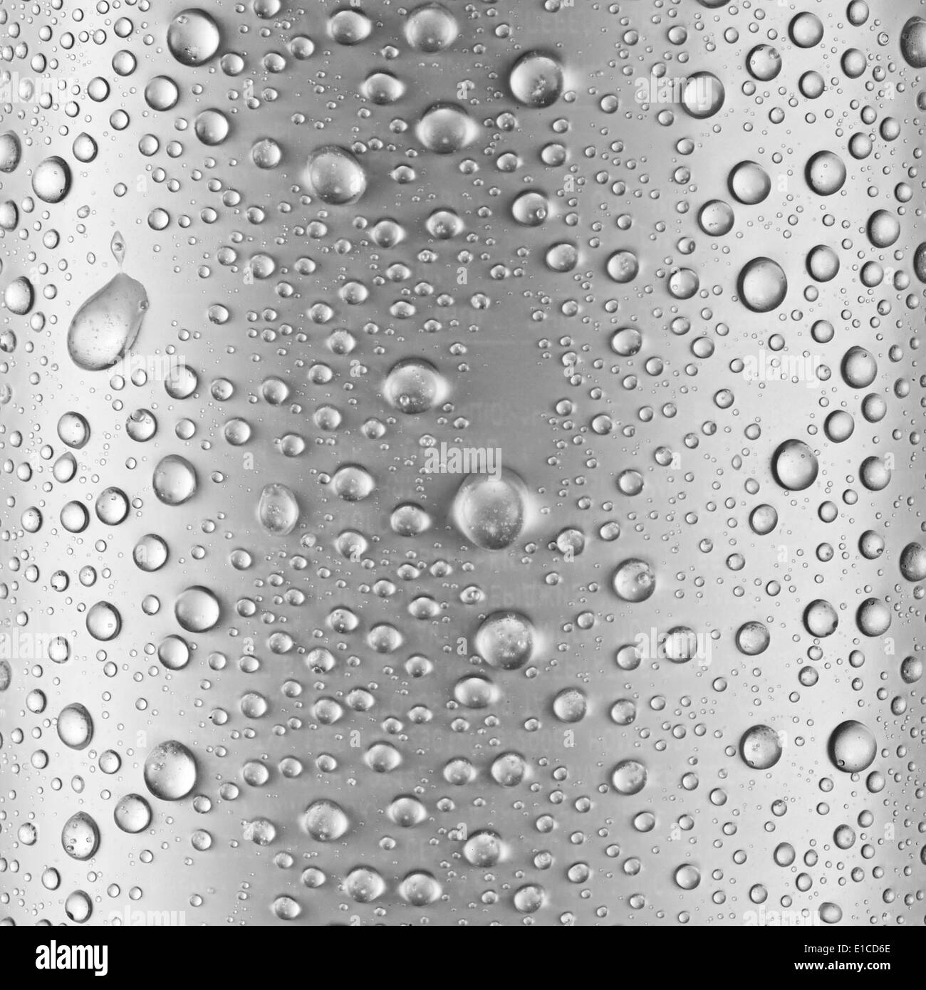 Water drops over gray glass background. Stock Photo