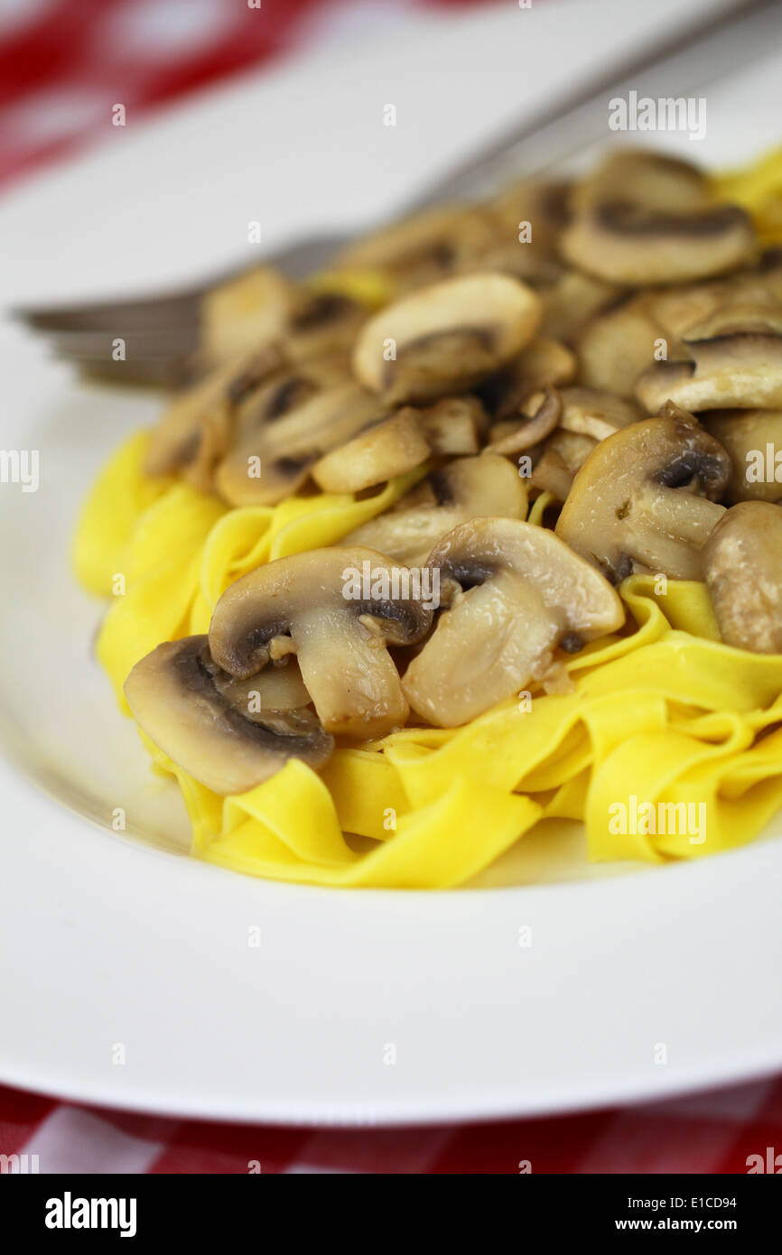 Pasta tagliatelle with mushrooms Stock Photo
